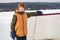 portrait of happy hockey player on a lake