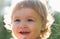 Portrait of a happy laughing child. Close up positive kids cropped face. Baby smiling, cute smile.