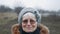 Portrait of a happy laughing old woman in stylish glasses. elderly woman puts on glasses and laughs at camera,close-up