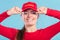 Portrait of happy lifeguard woman in red cap.