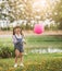 Portrait happy little girl with balloon