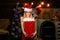 Portrait of happy Little girl looking at decorative toy ball by Christmas tree. Christmas teenager - happiness concept