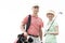 Portrait of happy male and female golfers standing against clear sky