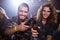 Portrait of happy male friends toasting beer bottles