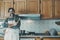 Portrait of happy man in the kitchen ready to cook food. Single lifestyle concept. Indoor leisure activity. Male people smile on