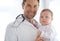 Portrait, happy man and pediatrician with baby for hospital assessment, medical support and growth. Pediatrics doctor