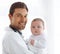 Portrait of happy man, pediatrician and baby for medical assessment, growth support and healthcare of children. Newborn