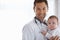 Portrait, happy man and pediatrician with baby on mockup for medical assessment, support and healthcare of children