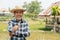 Portrait happy mature older man is smiling. Old senior farmer with white beard thumb up feeling confident.