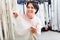 Portrait of happy mature woman with cloth specimens