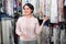 Portrait of happy mature woman with cloth specimens