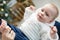 Portrait of happy mother and adorable baby celebrate Christmas.