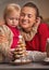 Portrait of happy mother and baby and cookie christmas tree