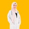 Portrait of happy muslim female doctor in standing and smiling