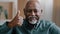 Portrait of happy old male ethnic elderly African American man senior showing thumb up positive grandfather looking at