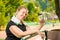 Portrait of a happy oversized woman with a bottle of water smiling, portrait after a workout