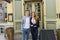 Portrait of happy owners standing in front of restaurant