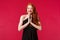 Portrait of happy and pleased cheerful young redhead woman, wearing black formal dress makeup, red lipstick, grinning