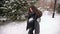Portrait of happy pregnant girl in winter Park.