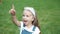 Portrait of happy pretty child girl in summer outdoors.