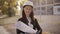 Portrait of Happy professional construction engineer woman holding the blueprint and wearing the safety helmet and
