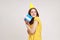 Portrait of happy satisfied teenager girl embracing blue gift box ,receiving surprise, being happy