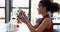 Portrait of happy schoolgirl experimenting molecule model in laboratory