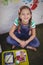 Portrait of happy schoolgirl having meal