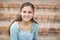 Portrait of happy schoolgirl sitting on staircase