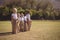 Portrait of happy schoolgirls standing in sack during race