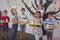 Portrait of happy schoolkids holding meal in tray