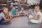 Portrait of happy schoolkids sitting in library