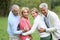 Portrait of happy senior couples outdoors