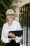 Portrait of a happy senior female agent with clipboard