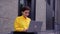 Portrait of happy skilled business lady with laptop outdoor