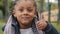 Portrait happy smiling afro american schoolgirl little girl african showing thumb up like support gesture symbol