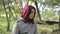 Portrait of happy smiling asian young woman in forest