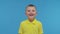 Portrait of happy smiling boy in t-shirt. Attractive and expressive kid in studio.