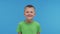 Portrait of happy smiling boy in t-shirt. Attractive and expressive kid in studio.