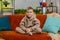 Portrait of happy smiling Caucasian preteen school boy child kid looking at camera, home play room