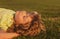 Portrait of a happy smiling child boy playing on grass field. Kids dreaming.