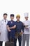 Portrait of Happy and Smiling Doctor, Air Stewardess, Construction Worker, and Chef- Studio Shot