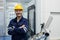 Portrait of happy smiling male engineer workers standing crossed arms in manufacturing factory workplace. professional technician