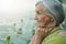 Portrait of happy smiling senior woman by lake