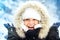 Portrait of happy, smiling woman, enjoying snow and winter days during cold season. Stylish portrait of beautiful woman