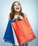 Portrait of happy smiling woman hold shopping bag. Female mode