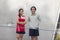 Portrait of a happy sports couple. Runners resting outside after a run. Together, they are achieving and maintaining their fitness