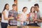 Portrait of happy students experimenting molecule model in laboratory