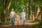 Portrait of a happy traditional family on walk in a summer park