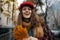 Portrait of happy trendy 40 years old woman in red hat